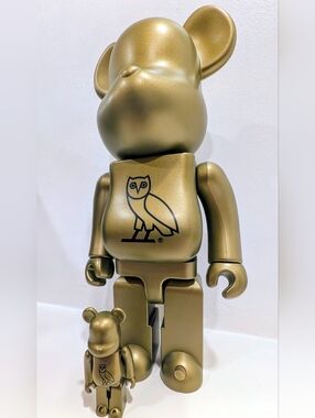 NIB OVO Gold Metallic Bearbrick with Black Owl Emblem